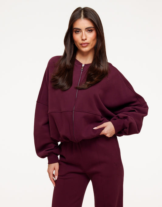KLEDING-AUBERGINE-JOGGING-RITS-VEST-AUBERGINE-JOGGING-BROEK-01