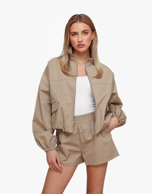 Donker Taupe Puffy Elastische Onderkant - Jas - Olivia & Kate